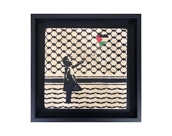 Arte en piedra con diseño de keffiyeh de niña con globo palestino de Banksy