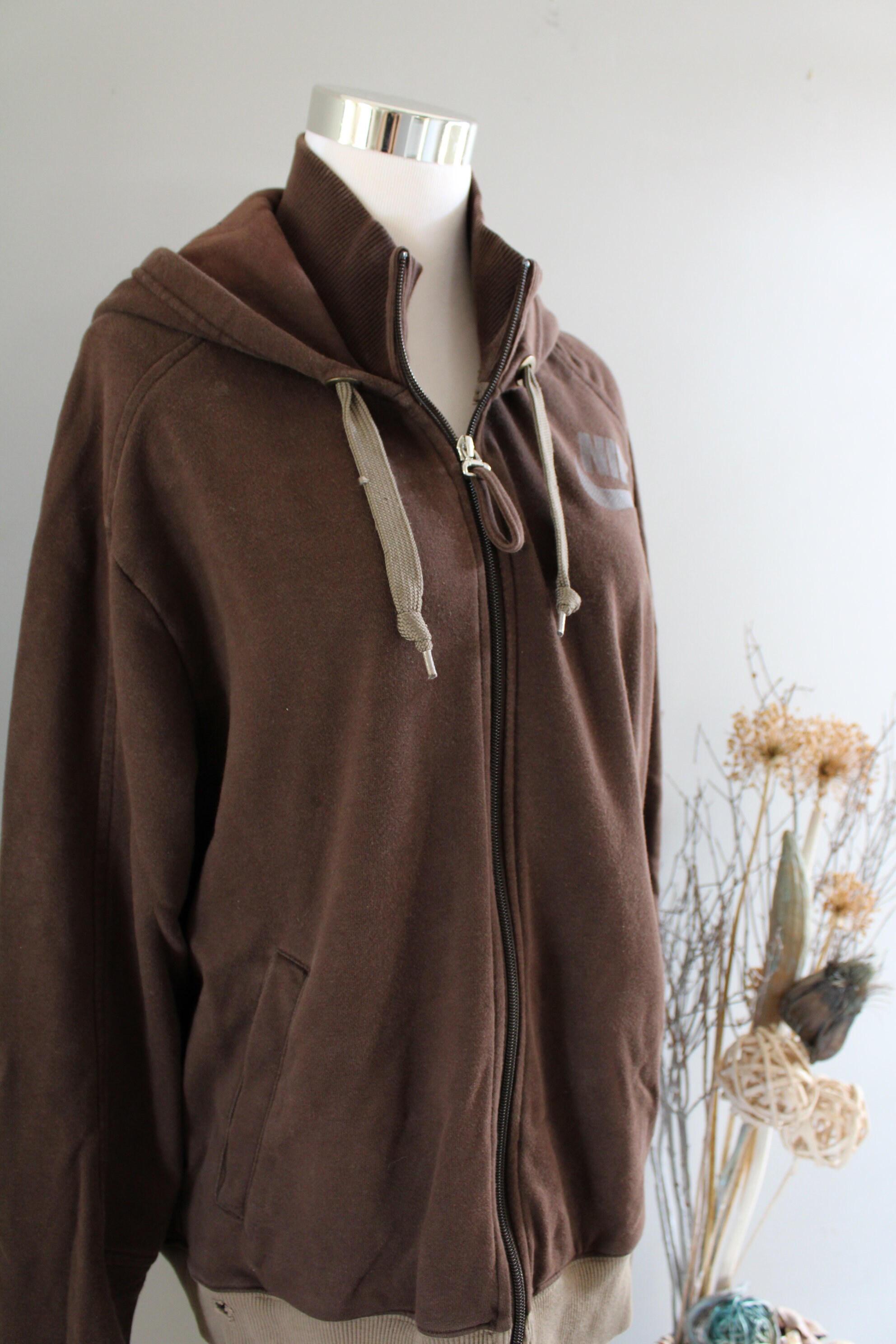 brown hoodie with pink writing