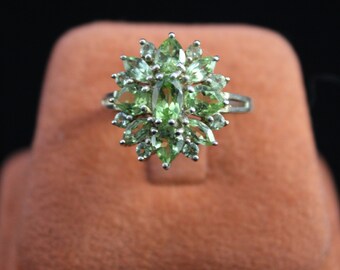 A Pretty Solid Silver and Peridot Cluster Ring Set With 17 Green Peridots Oval, Pear, Round And Marquise Shaped Circa 2000