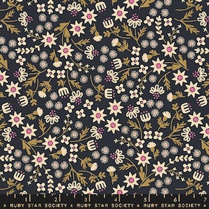 May include: A dark blue fabric with a repeating pattern of white and pink flowers and gold leaves. The fabric has a subtle sheen and a soft texture.