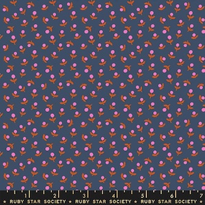 May include: Navy blue fabric with a repeating pattern of small pink flowers and orange leaves. The flowers have a dotted texture. The fabric is marked with a ruler and the text "RUBY STAR SOCIETY".