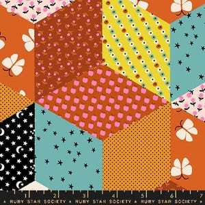 May include: A colourful fabric with a patchwork design featuring various patterns, including stars, butterflies, apples, and polka dots. The fabric is in shades of orange, yellow, pink, blue, and black.