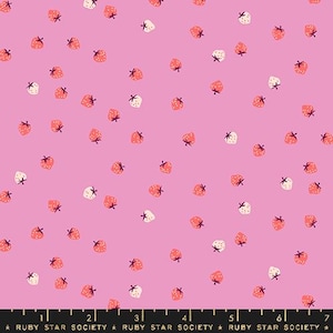 May include: Pink fabric with a scattered strawberry pattern. The strawberries are in shades of red and white, each with a small green stem. The fabric has the text "RUBY STAR SOCIETY" at the bottom.