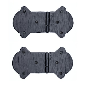 May include: Two black metal hinges with a decorative design. The hinges are closed and have a textured surface.