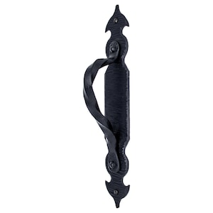 May include: Black wrought iron door pull with a twisted handle and decorative accents.