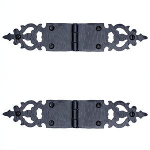 May include: Two black metal hinges with ornate decorative details. The hinges are closed and have a hammered finish.