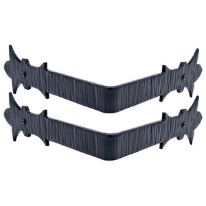 May include: Two black metal corner brackets with a decorative, pointed design. The brackets are made of a textured metal and have a slightly curved shape.