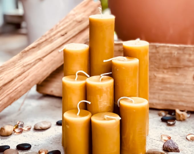 100% Pure Beeswax Pillar candles. 2" in diameter and up to 8" tall Natural Honey, Heilala Vanilla, Ceylon Cinnamon or lemon scented