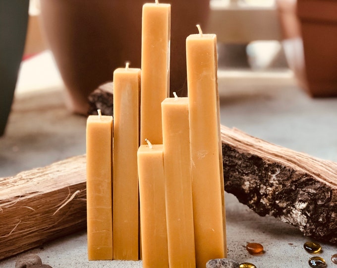 This set of 3 unique square 100% pure beeswax pillar candles. Rustic and modern organic pure beeswax candle set. 1" wide and up to 9" tall.