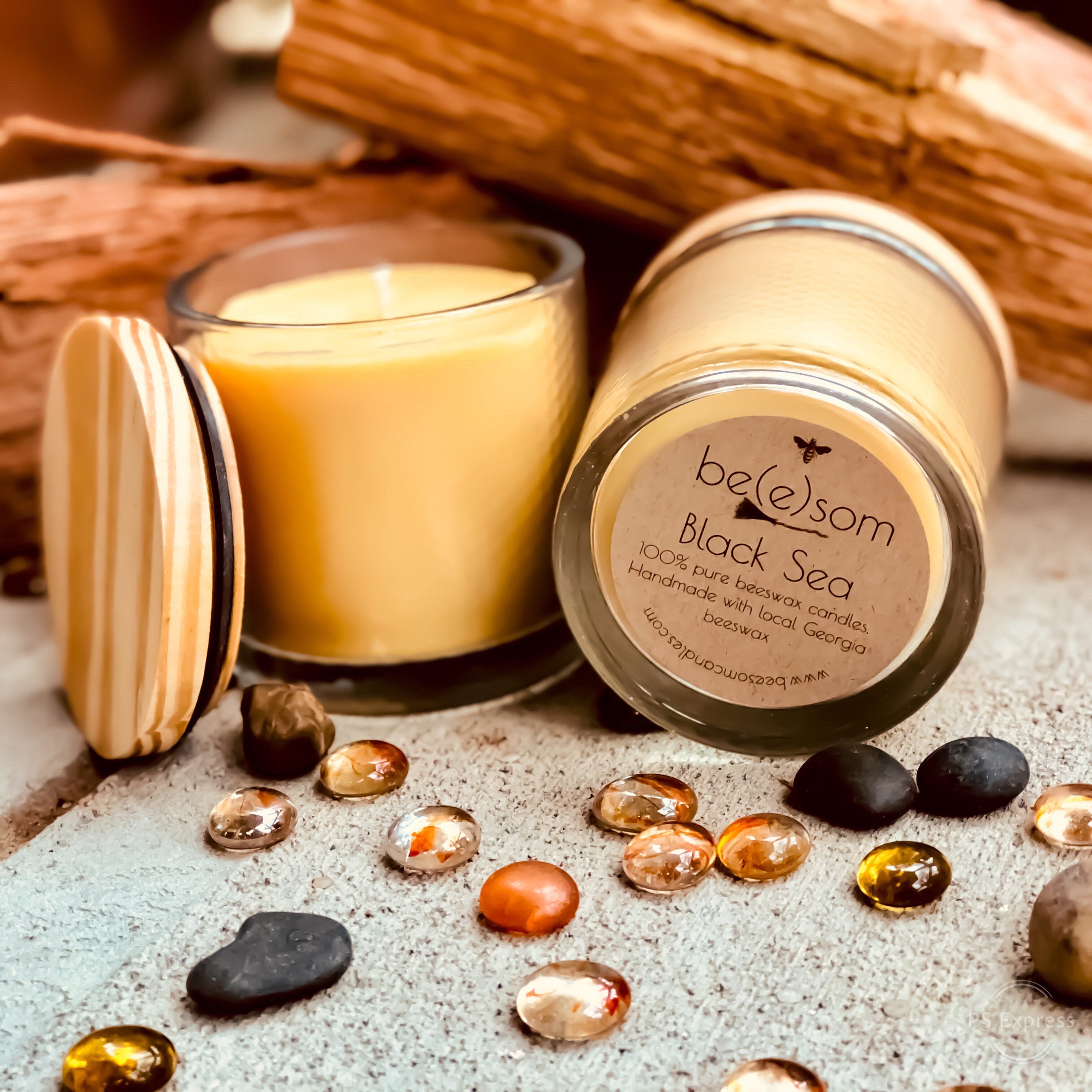 Pure organic beeswax candle in a large glass jar topped with wooden lid