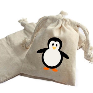 May include: Two small, natural-colored cotton drawstring bags. One bag has a black and white penguin design with an orange beak and feet.