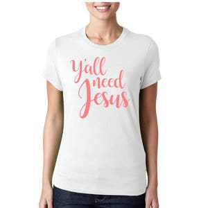 May include: White t-shirt with the text "y'all need Jesus" in pink lettering.