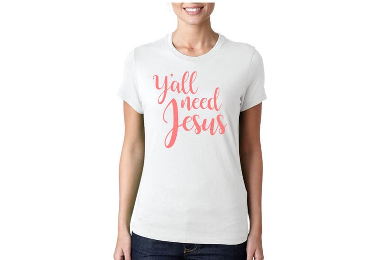 May include: White t-shirt with the text "y'all need Jesus" in pink lettering.