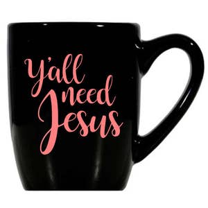 May include: Black ceramic coffee mug with a white handle. The mug has the text "y'all need Jesus" written in pink.