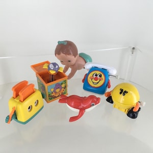Vintage Tomy Wind Up Toys 1980’s. Telephone, Box Pops, Seal, Toaster, Pac Man, or Crawling Baby