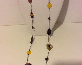 Yellow and brown multi color long resin bead necklace