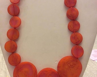 Orange resin graduated circles necklace