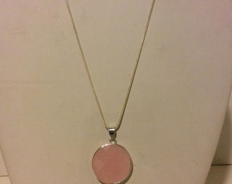 Round pink stone and sterling silver pendant necklace