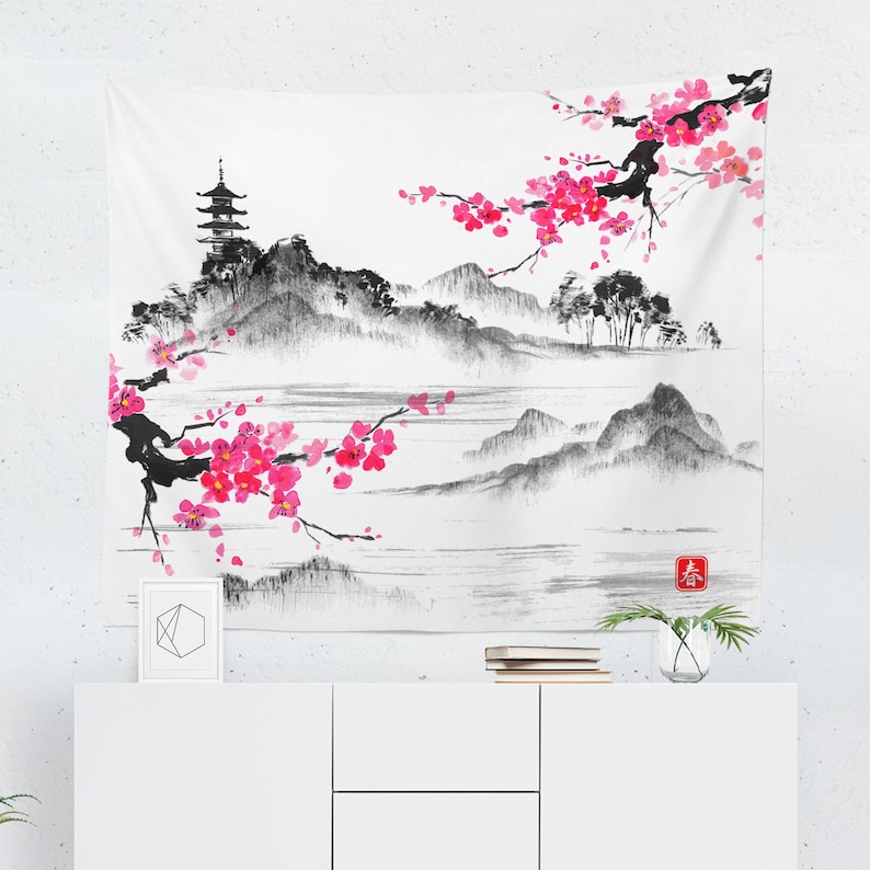 May include: A black and white ink painting of a Japanese landscape with a pagoda, mountains, and a river. Pink cherry blossoms are blooming on a branch in the foreground. The painting has a red seal in the lower right corner.