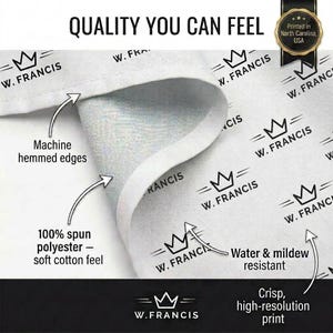 The image is a close-up of a fabric with the W. Francis logo printed on it. The fabric appears to be made of a soft, plush material, and the logo is clearly visible. The image also includes text that describes the quality of the fabric, such as the 100% spinnable polyester material and the water and mildew resistant properties.
