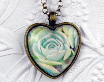 green succulent necklace with heart-shaped glass cabochon