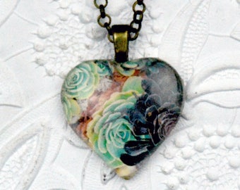 black and green succulent photo necklace on heart-shaped glass cabochon
