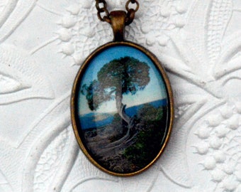 tree necklace in copper setting with oval bezel and cabochon