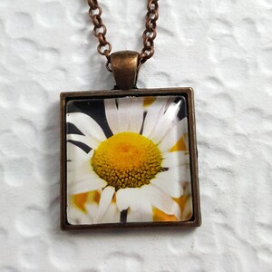 square daisy necklace in copper setting