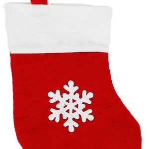 May include: A red Christmas stocking with a white cuff and a white snowflake applique. The stocking has a red loop for hanging. Festive holiday decor.