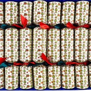 May include: A box of Christmas crackers. Each cracker is cylindrical, decorated with a repeating pattern of green elves and gift boxes on a cream background. The crackers are tied with red and green ribbons.