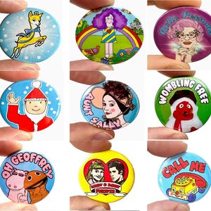 May include: Nine circular pin badges with vibrant designs. The badges showcase illustrations such as a cartoon deer, a woman with purple hair, a woman with glasses, Santa Claus, a woman with a hat, a red puppet, a hippo and a puppet, a couple, and a telephone.