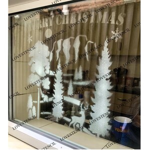 May include: A frosted glass window with a stencil design of a Christmas tree, a snowman, and the words "Merry Christmas".