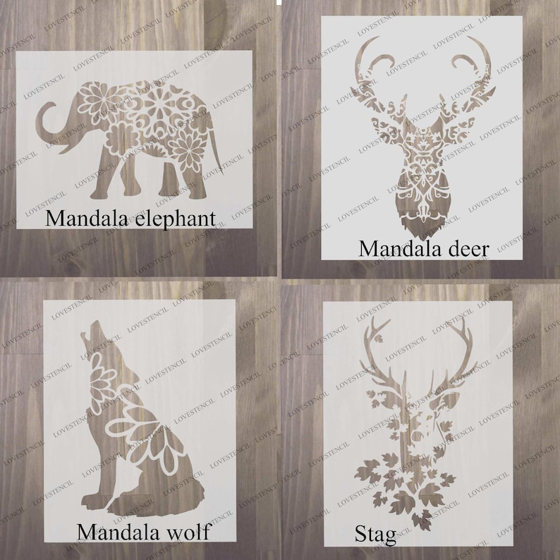 Peut inclure: Quatre pochoirs d'animaux mandala diff&eacute;rents. Les pochoirs sont sur un fond en bois. Les animaux sont un &eacute;l&eacute;phant, un cerf, un loup et un cerf. Les pochoirs sont tous blancs et ont des motifs complexes.