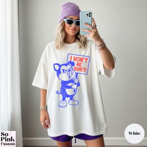 Comfort Colors Shirt with retro cartoon pig holding a protest sign with text I Won't Be Quiet!