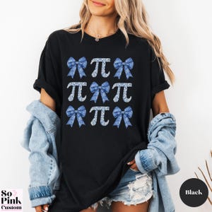 Comfort Colors®  Coquette blue toile de jouy pi shirt with bows and pi symbols laid out in a 3 x 3  grid