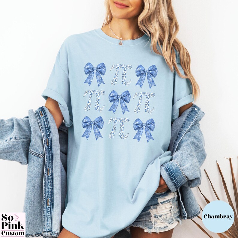 Comfort Colors®  Coquette blue toile de jouy pi shirt with bows and pi symbols laid out in a 3 x 3  grid