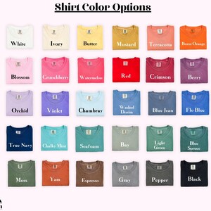 May include: A display of folded t-shirts in various colors, including white, ivory, and black. The image features a color chart with options like "Blossom," "Chambray," and "Espresso." The text "Shirt Color Options" is at the top, with "So Pink Custom" at the bottom.