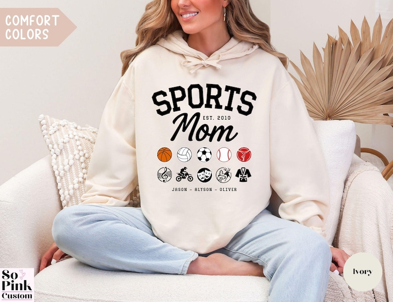 Multiple Sports Mom Hooded Sweatshirt with various sports ball icons, year established and kids names, mixture of college and cursive fonts