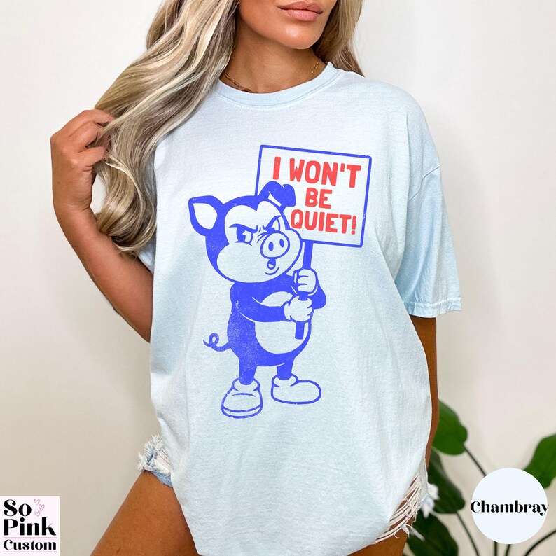 Comfort Colors Shirt with retro cartoon pig holding a protest sign with text I Won't Be Quiet!
