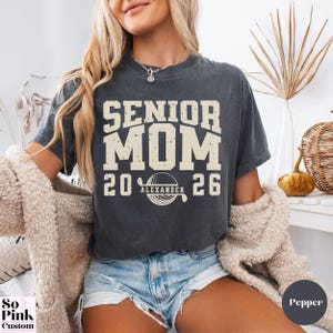 Comfort Colors Senior Golf Mom Shirt Personalized with Name and Year, bold collegiate font with golf ball monogram, distressed graphic