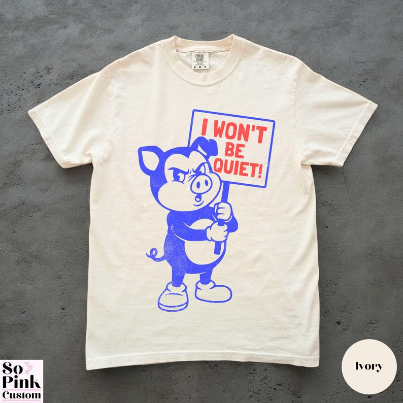 Comfort Colors Shirt with retro cartoon pig holding a protest sign with text I Won't Be Quiet!