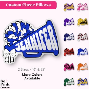 May include: A blue and white cheer pillow shaped like a megaphone with a white pom-pom on top. The pillow says "Jennifer" in white letters. The pillow is available in two sizes: 16 inches and 22 inches. More colors are available.
