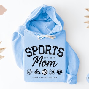 Multiple Sports Mom Hooded Sweatshirt with various sports ball icons, year established and kids names, mixture of college and cursive fonts