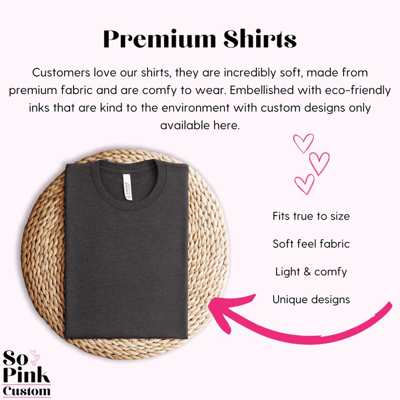 May include: A dark gray t-shirt on a woven straw mat. The t-shirt is made from soft, eco-friendly fabric and is available in custom designs. The text "So Pink Custom" is in the lower left corner of the image.