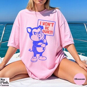 Comfort Colors Shirt with retro cartoon pig holding a protest sign with text I Won't Be Quiet!