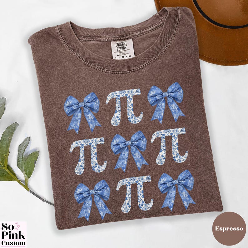 Comfort Colors®  Coquette blue toile de jouy pi shirt with bows and pi symbols laid out in a 3 x 3  grid