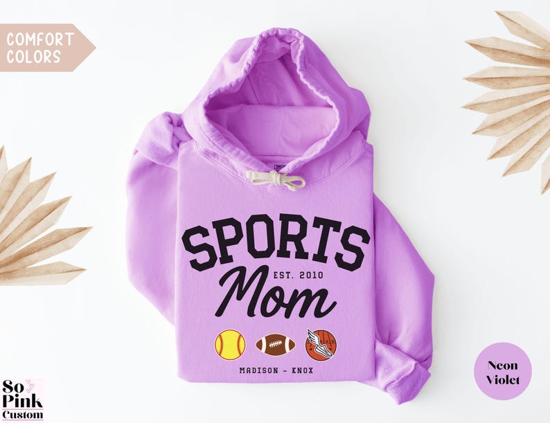 Multiple Sports Mom Hooded Sweatshirt with various sports ball icons, year established and kids names, mixture of college and cursive fonts