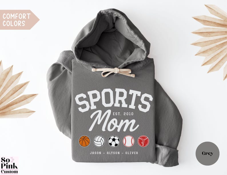 Multiple Sports Mom Hooded Sweatshirt with various sports ball icons, year established and kids names, mixture of college and cursive fonts