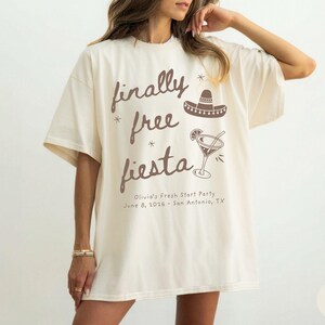 Matching Divorce Party Comfort Colors Shirts, Finally Free Fiesta  - Freedom Fiesta Crew, in a handwritten font with mexican hat, margarita cocktail, doodle stars and personalized with name and party details