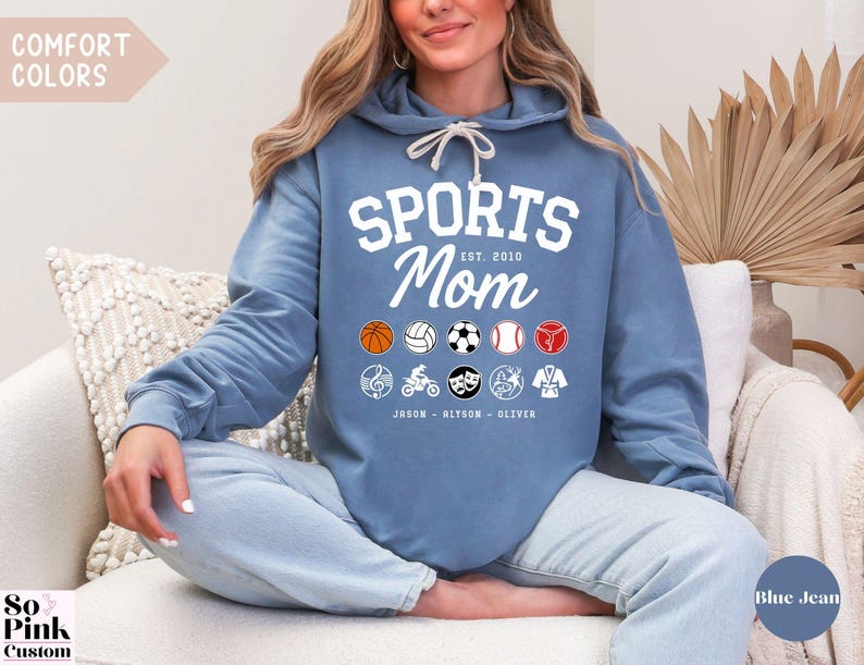 Multiple Sports Mom Hooded Sweatshirt with various sports ball icons, year established and kids names, mixture of college and cursive fonts